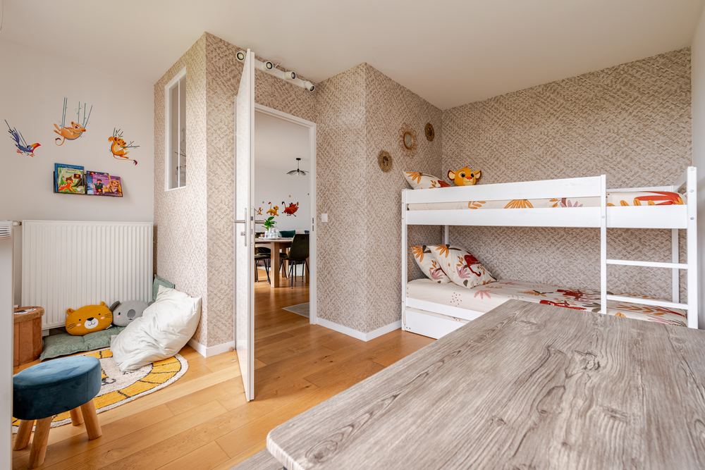 Children's bedroom with bunk beds and Lion King decals
