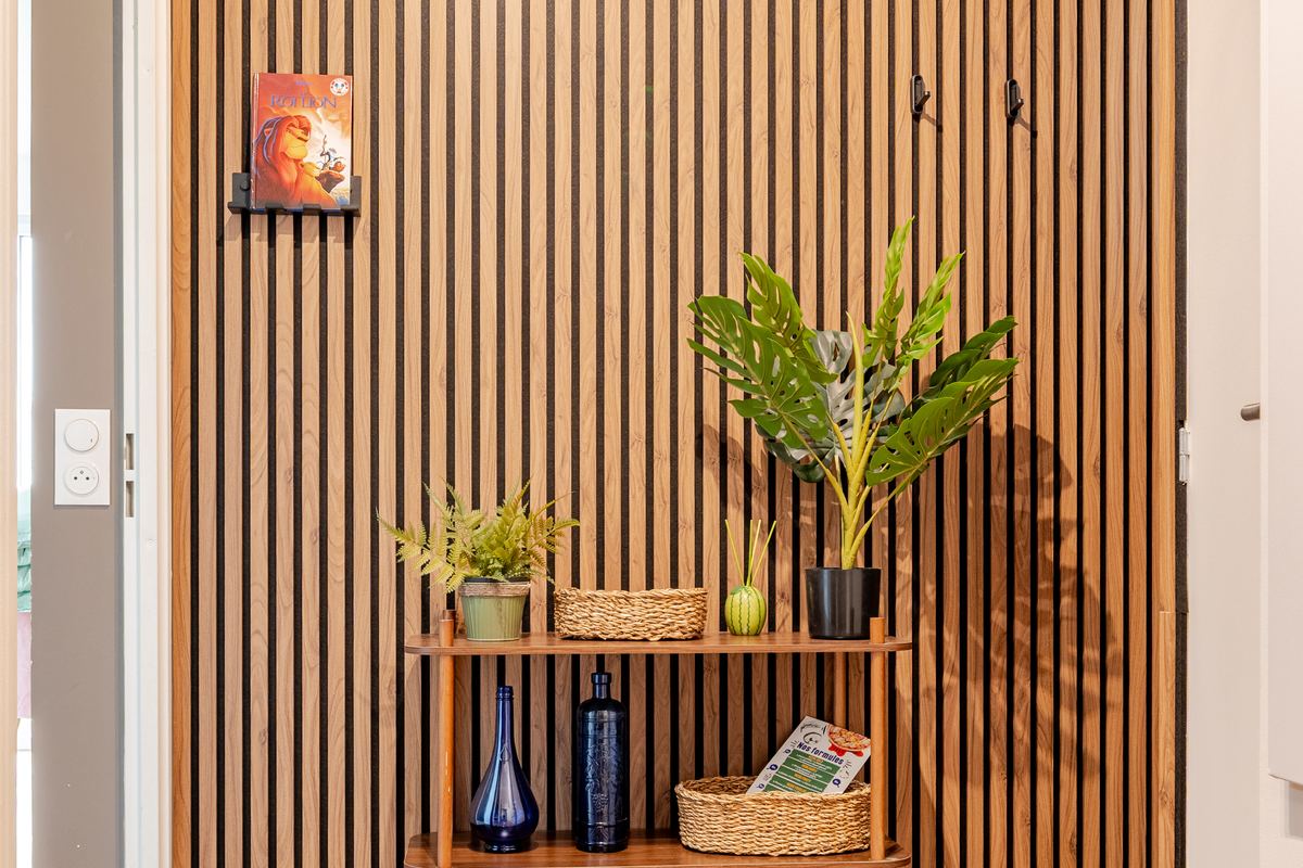 Entrance with wood shelving opening onto the living room